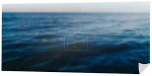 Blurred shot of sea and sky at background 