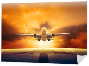 Samolotu pasażerskiego jet latające nad pięknym poziomem morza ze słońca