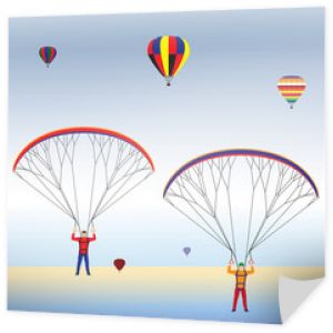 Paralotniarstwo i balony na niebie.