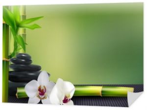 Kamień, kwiat i bambus na tle stołu