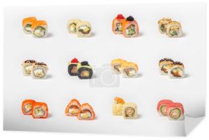 Duży zestaw różnych rodzajów sushi maki na neutralnym tle światła