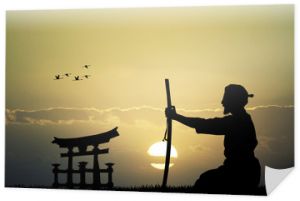 Japończyk z mieczem o zachodzie słońca