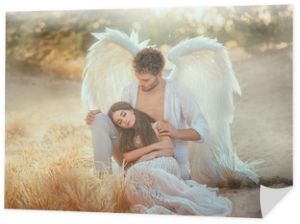 Men guardian angel protects and hugs young woman. Sleeping beauty vintage pastel color, miracle dream. Fabulous old warm yellow autumn nature. Bright sun shine light. Creative white suit design wing