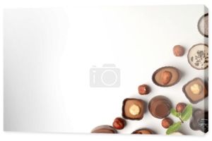 Płaska kompozycja świecka z czekoladowymi cukierkami na białym tle