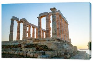 ancient columns of parthenon against blue sky 