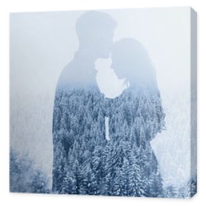 love in winter, silhouette of couple on forest background, double exposure